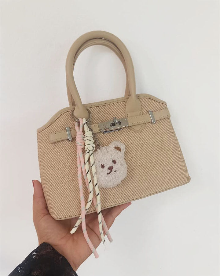 Mini cartera con cierre frontal decorativo y llavero de osito