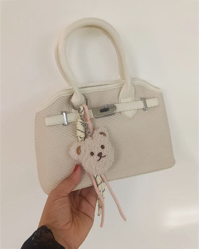 Mini cartera con cierre frontal decorativo y llavero de osito