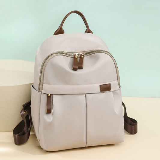 Mochila en tela con bolsillo frontal y bolsillos laterales