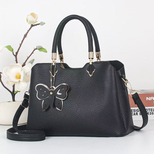 Cartera mediana con llavero mariposa