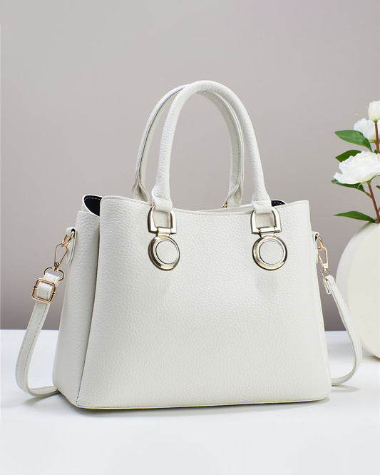 Bolso elegante de doble asa con aros decorativos
