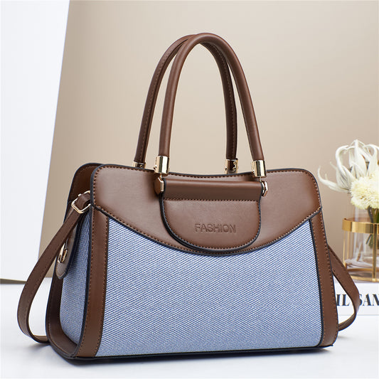 Bolso medianao con estructura rectangular, doble asa y correa ajustable